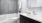 Bath with dual vanity, large mirror and glass enclosed showerA