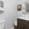 Bath with dual vanity, large mirror and glass enclosed shower