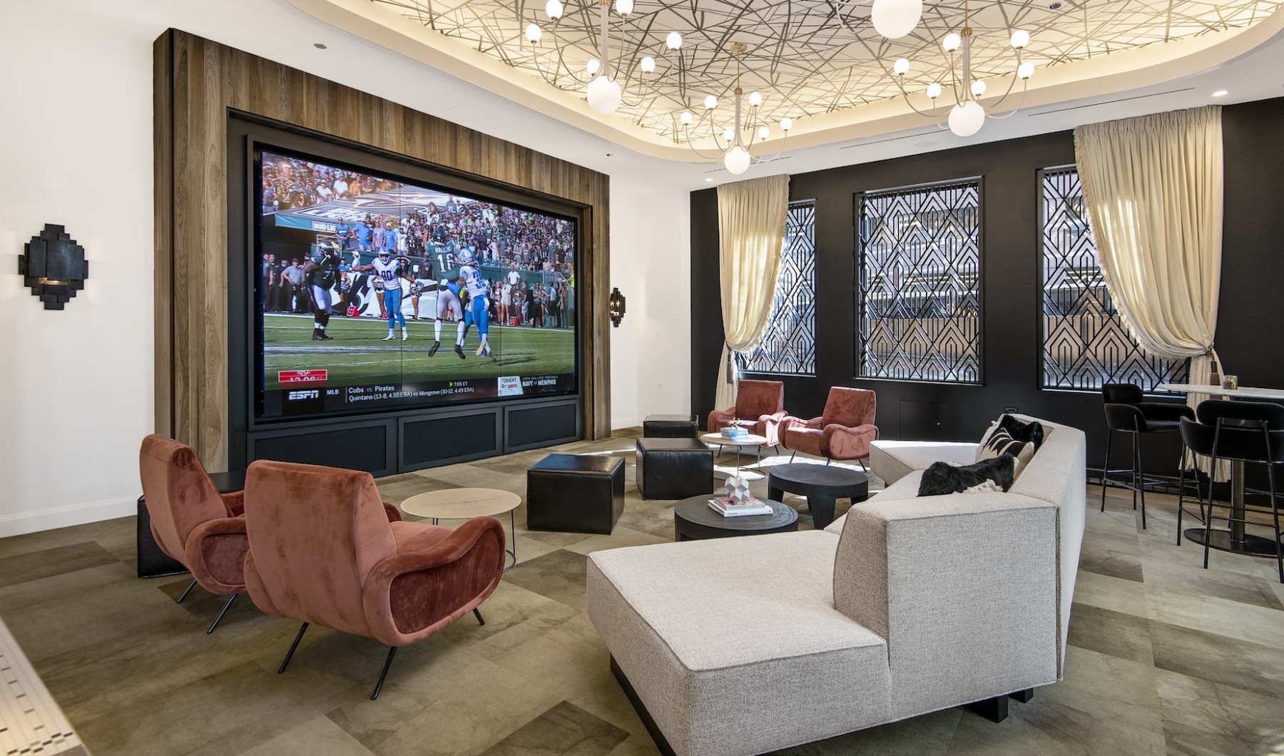 Clubhouse Resident clubhouse with ample seating, fireplace, demo kitchen and TVs